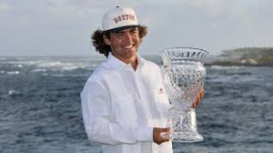 South African golfer Garrick Higgo holds